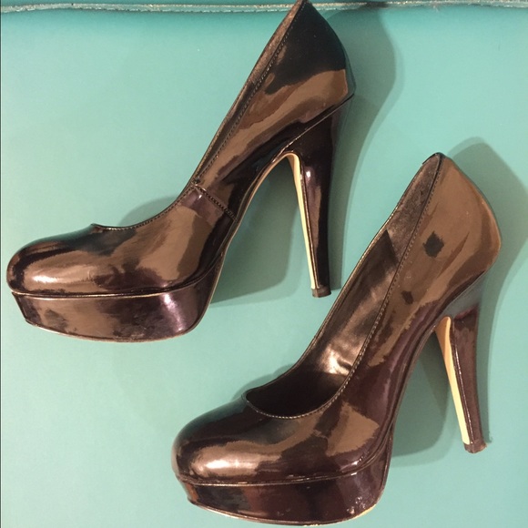 GUESS black patent platform stilettos.