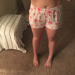 High waisted floral shorts with poms on the bottom