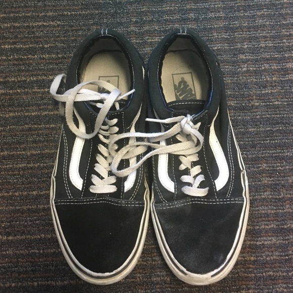 Black low top lace-up vans