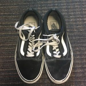 Black low top lace-up vans