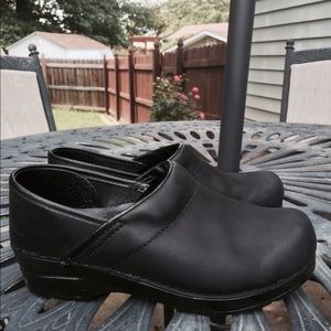 Matte black Dandko clogs.
