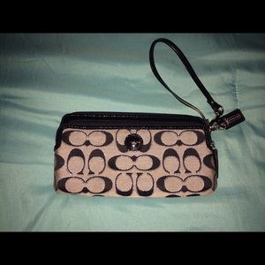 Black and silver Coach wristlet
