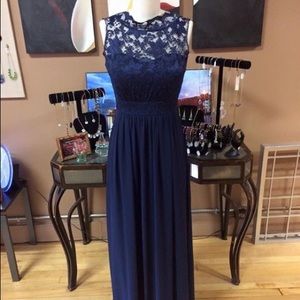 Navy blue formal dress with lace overlay bodice.