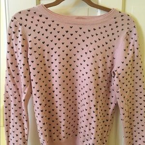 Pink and black sweater with hearts.