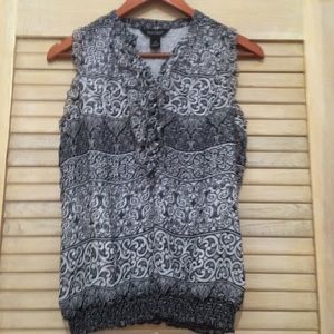 Black and white sleeveless blouse