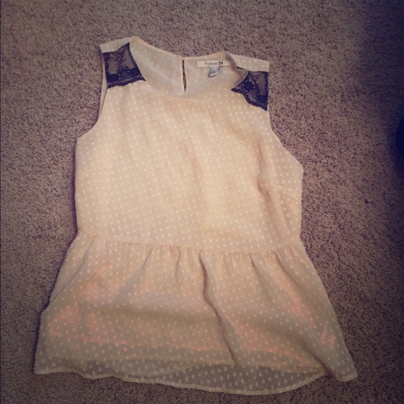 Sleeveless cream and black top