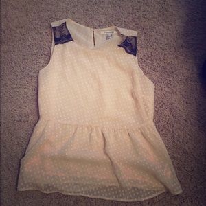 Sleeveless cream and black top