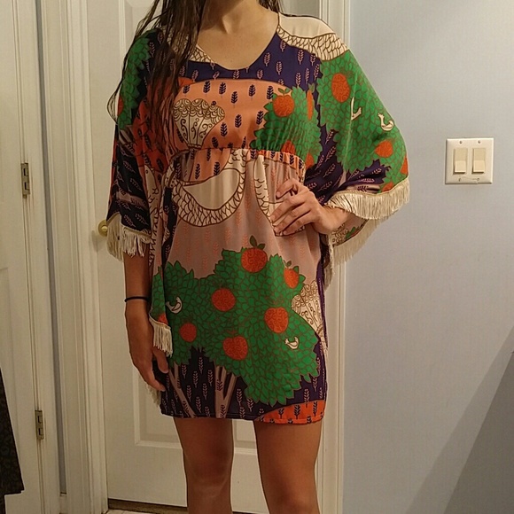 Fun and flirty peacock mini