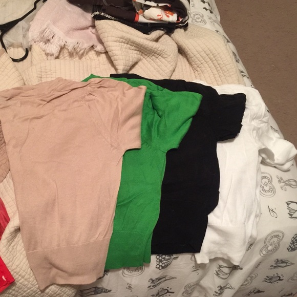 Four multi colored short sleeve sweater coverups