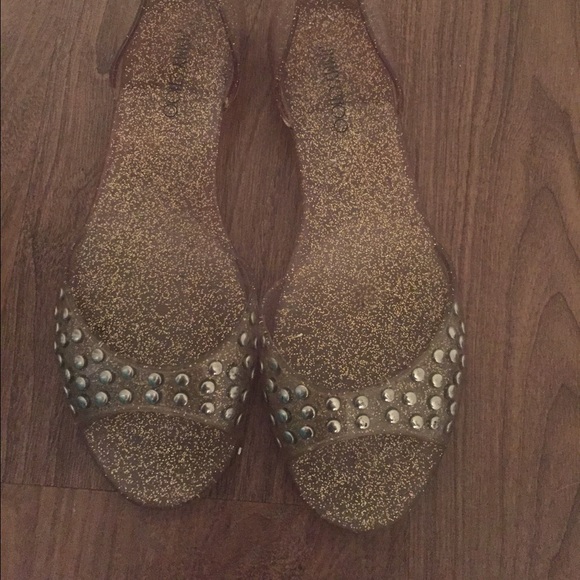 JIMMY CHOO gold and silver open toe jellies.