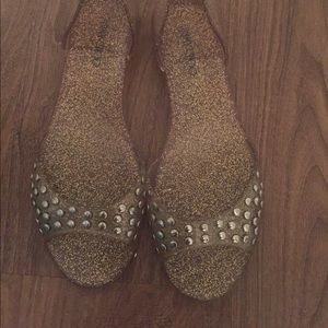 JIMMY CHOO gold and silver open toe jellies.