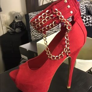 Red pumps with gold chain heels size 6.5.