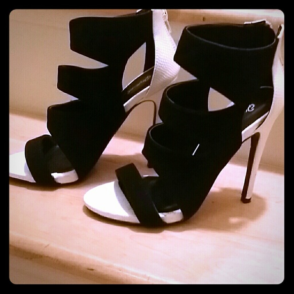 Black and white zip up ankle heels