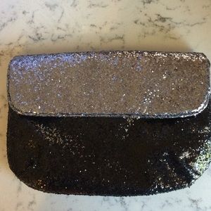Black and silver glitter purse.