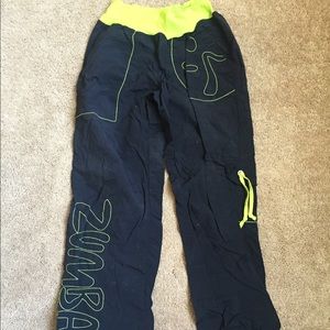 Black Zumba pants with green accent size medium
