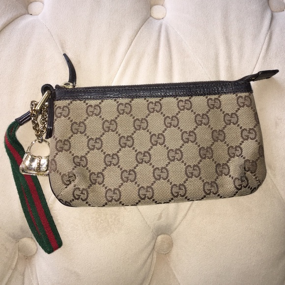 Gucci monogram wristlet.