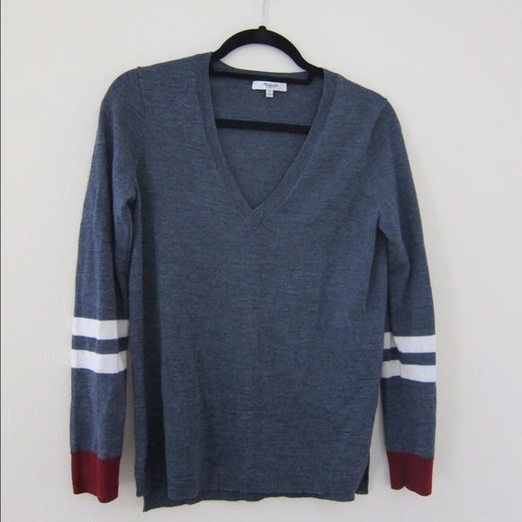 V neck sweater with side slit hem.