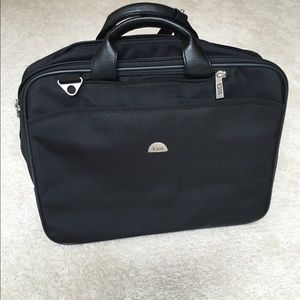 Tumi laptop/briefcase.  Black, not leather.