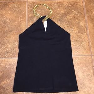 Black top with golden neck attachment