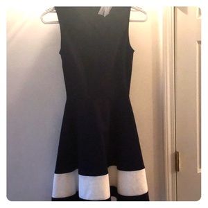 Above the knee. Never worn, from Bloomingdales.