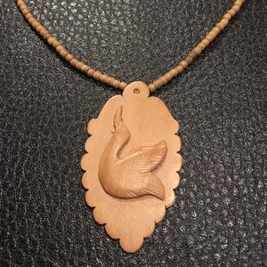 Wooden rare bird necklace.