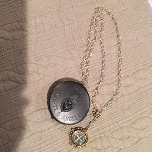 Virgins Saints and Angels Rosary Necklace in gold.