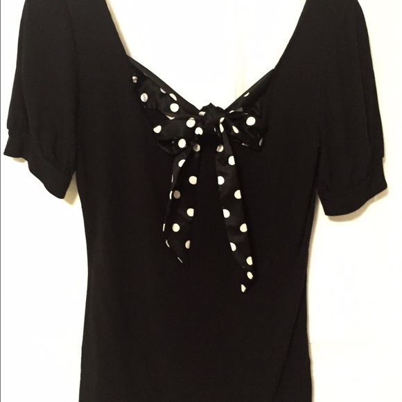 Black shirt with polka dot ribbon that ties