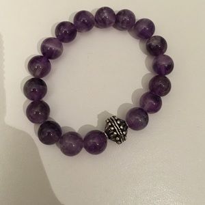 Purple beaded bracelet with silver accent bead