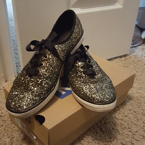black and gold champion shoes