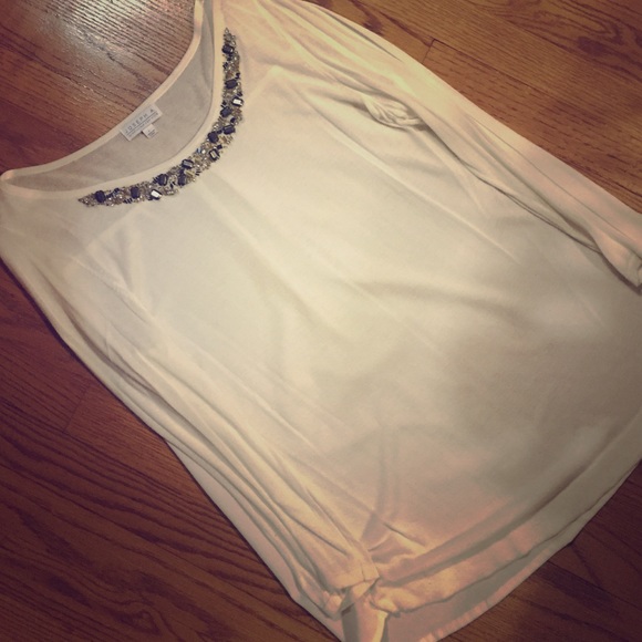 Cream dressy sweater with beading at the top