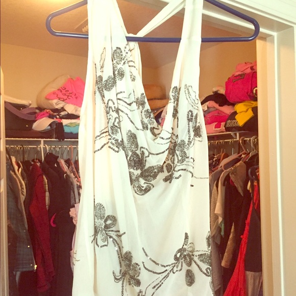 Sheer, sleeveless and split back gorgeous blouse.