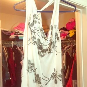 Sheer, sleeveless and split back gorgeous blouse.