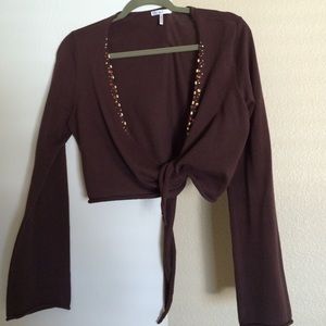 Shrug with beads down the front.