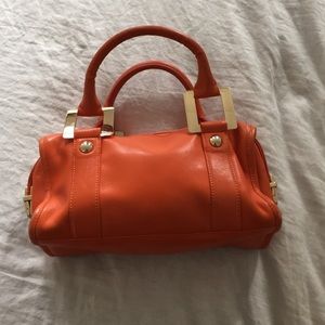 Orange leather handbag