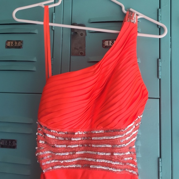 Bright orange party dress.