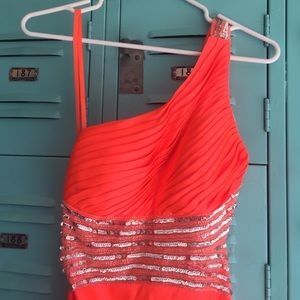 Bright orange party dress.