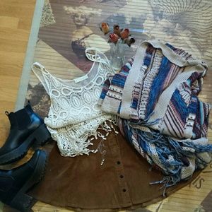 White lace shirt, cardigan, and music necklace