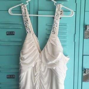 White dress. Could be a bridal or prom