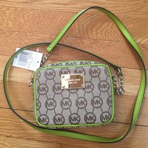 Lime green and tan small Michael Kors purse.