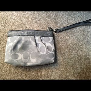 Authentic Coach wristlet.