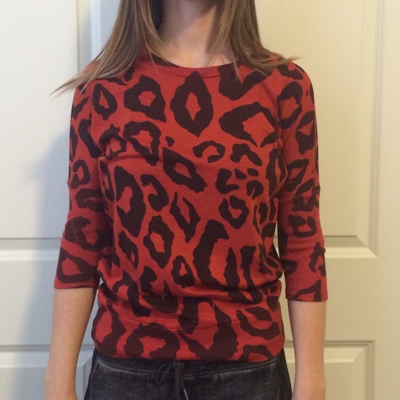 Orange leopard sweater.