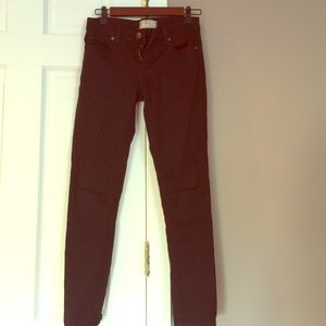 Free People black skinny jeans with slit on knees