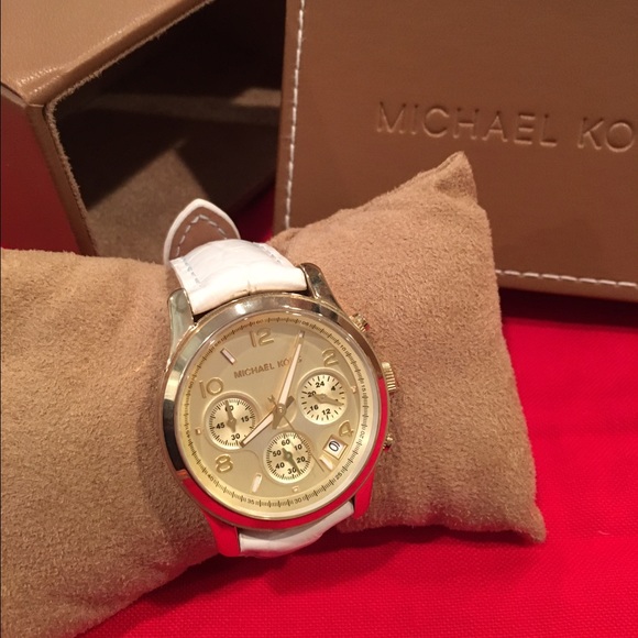Michael kors white leather and gold tone watch.