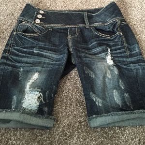 Mid length blue jean shorts