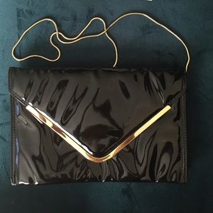 Patent envelope clutch with gold hardware