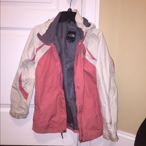 Pink and white North Face rain jacket