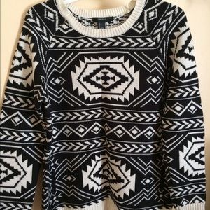 Black and white patterned knitted sweater.