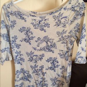 Blue and white mid sleeve shirt.