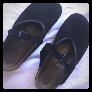 Black Birkenstock slip ons,adjustable buckle.