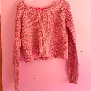 It's a pink cropped sweater!